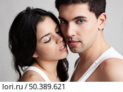 Sexy young couple isolated on a gray background. Стоковое фото, агентство Ingram Publishing / Фотобанк Лори