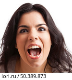 Portrait of a  young woman with a crazy expresion, isolated over white background. Стоковое фото, агентство Ingram Publishing / Фотобанк Лори