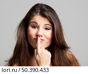 Studio portrait of a beautiful and expressive young woman. Стоковое фото, агентство Ingram Publishing / Фотобанк Лори