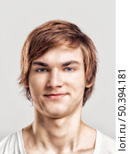 Portrait of a handsome young man, over a gray background. Стоковое фото, агентство Ingram Publishing / Фотобанк Лори