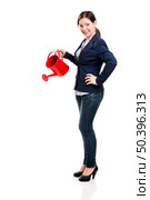Business woman holding a water can, isolated over white background. Стоковое фото, агентство Ingram Publishing / Фотобанк Лори