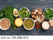 elevated view fresh vegetables pulses black wooden desk. Стоковое фото, агентство Ingram Publishing / Фотобанк Лори