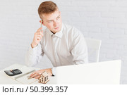 thoughtful handsome realtor office. Стоковое фото, агентство Ingram Publishing / Фотобанк Лори