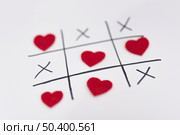tic tac toe game with hearts crosses. Стоковое фото, агентство Ingram Publishing / Фотобанк Лори