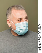 bearded man with surgical mask. Стоковое фото, агентство Ingram Publishing / Фотобанк Лори