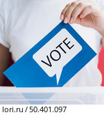 OLYMPUS DIGITAL CAMERA. close up blue card with voting speech bubble. Стоковое фото, агентство Ingram Publishing / Фотобанк Лори