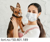 close up girl with mask holding dog. Стоковое фото, агентство Ingram Publishing / Фотобанк Лори