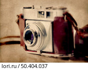 Old fashioned photography camera isolated over a white background. Стоковое фото, агентство Ingram Publishing / Фотобанк Лори