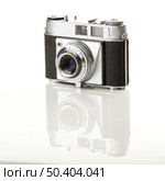 Old fashioned photography camera isolated over a white background. Стоковое фото, агентство Ingram Publishing / Фотобанк Лори
