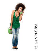Afro-American young woman answering a call and yelling at phone, isolated on white background. Стоковое фото, агентство Ingram Publishing / Фотобанк Лори
