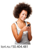 Beautiful African American woman sending a sms on cell phone, isolated on white background. Стоковое фото, агентство Ingram Publishing / Фотобанк Лори