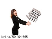 Woman in the office stumbling with a pile of folders in the hands, isolated on white. Стоковое фото, агентство Ingram Publishing / Фотобанк Лори