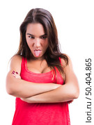 Beautiful young woman making  a grimace with her tongue off, isolated over a white background. Стоковое фото, агентство Ingram Publishing / Фотобанк Лори