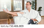 martial arts instructors training together practice hall. Стоковое фото, агентство Ingram Publishing / Фотобанк Лори