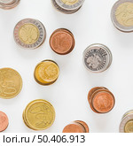 overhead view silver gold copper coins white background. Стоковое фото, агентство Ingram Publishing / Фотобанк Лори