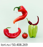 front view bell chili peppers with tomato. Стоковое фото, агентство Ingram Publishing / Фотобанк Лори