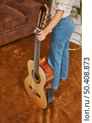 young little girl playing guitar home 3. Стоковое фото, агентство Ingram Publishing / Фотобанк Лори
