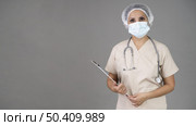 doctor wearing mask. Стоковое фото, агентство Ingram Publishing / Фотобанк Лори
