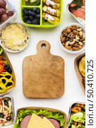 composition different foods with wooden board. Стоковое фото, агентство Ingram Publishing / Фотобанк Лори