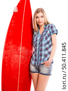 Beautiful young woman with a surfboard, over a gray background. Стоковое фото, агентство Ingram Publishing / Фотобанк Лори