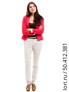 Modern business woman with a thinking expression and standing over a white background. Стоковое фото, агентство Ingram Publishing / Фотобанк Лори