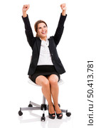 Happy business woman sitting on chair with arms up, isolated over white background. Стоковое фото, агентство Ingram Publishing / Фотобанк Лори