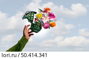 Stop war and No violence concept as a grenade weapon with flowers as a person throwing a symbol for peace and hope with an unexploded bomb or disarmed explosive to spread love with 3D illustration elements. Стоковое фото, агентство Ingram Publishing / Фотобанк Лори