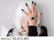 woman with eye tattoo. Стоковое фото, агентство Ingram Publishing / Фотобанк Лори