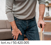 adult male using crutches walk. Стоковое фото, агентство Ingram Publishing / Фотобанк Лори
