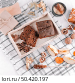 OLYMPUS DIGITAL CAMERA. chocolate pie with gift boxes table. Стоковое фото, агентство Ingram Publishing / Фотобанк Лори