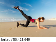 Shoot of a beautiful woman exercising herself in the beach. Стоковое фото, агентство Ingram Publishing / Фотобанк Лори