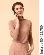 woman having pleasant conversation mobile phone. Стоковое фото, агентство Ingram Publishing / Фотобанк Лори