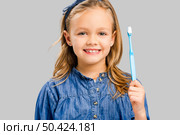 Happy little girl brushing her teeth. Стоковое фото, агентство Ingram Publishing / Фотобанк Лори