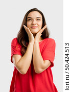 Portrait of a beautiful lovely woman with a dreaming expression. Стоковое фото, агентство Ingram Publishing / Фотобанк Лори