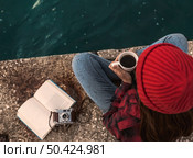 Beautiful woman enjoying her day in the lake with a mug of hot coffee. Стоковое фото, агентство Ingram Publishing / Фотобанк Лори