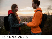 side view couple holding hands sunset road trip. Стоковое фото, агентство Ingram Publishing / Фотобанк Лори