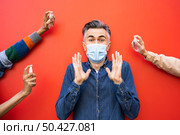 social distance concept with disinfectant 2. Стоковое фото, агентство Ingram Publishing / Фотобанк Лори