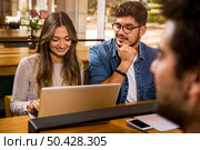 Group of young people studying together for the upcoming exams. Стоковое фото, агентство Ingram Publishing / Фотобанк Лори