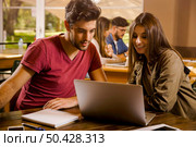 Studying working together for the final exams. Стоковое фото, агентство Ingram Publishing / Фотобанк Лори