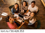 Group of friends studying together for finals. Стоковое фото, агентство Ingram Publishing / Фотобанк Лори