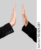 Hands making a give me five compliment over a gray background. Give me five. Стоковое фото, агентство Ingram Publishing / Фотобанк Лори