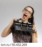 Crazy woman hanging with a clapboard. Стоковое фото, агентство Ingram Publishing / Фотобанк Лори