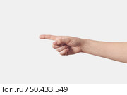 Right caucasian female hand pointing right direction, 1, one, first, letter D in finger alphabetic gesturing isolated on white background.. Pointing woman right hand isolated on white. Стоковое фото, агентство Ingram Publishing / Фотобанк Лори