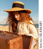 medium shot girl wearing hat. Стоковое фото, агентство Ingram Publishing / Фотобанк Лори