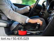 side view businesswoman using stick shift her car. Стоковое фото, агентство Ingram Publishing / Фотобанк Лори