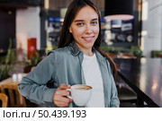 pretty young woman enjoying coffee cup 12. Стоковое фото, агентство Ingram Publishing / Фотобанк Лори
