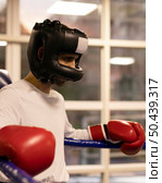 side view male boxer with helmet ring. Стоковое фото, агентство Ingram Publishing / Фотобанк Лори