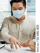 businessman wearing medical masks work. Стоковое фото, агентство Ingram Publishing / Фотобанк Лори