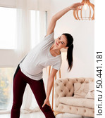 front view young pregnant woman exercising fitness mat. Стоковое фото, агентство Ingram Publishing / Фотобанк Лори