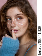 mysterious freckled woman with white flowers her face. Стоковое фото, агентство Ingram Publishing / Фотобанк Лори